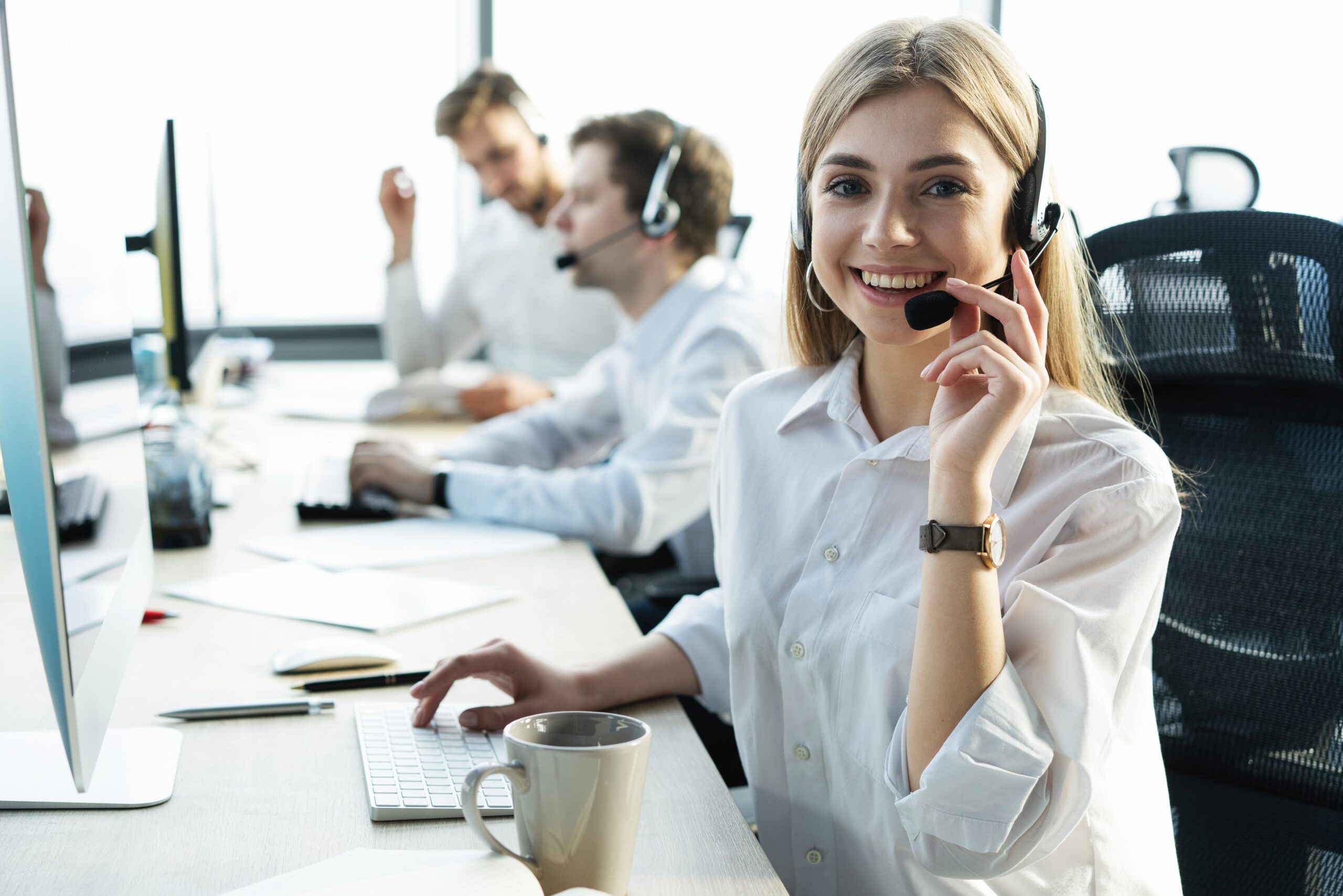 Female,Customer,Support,Operator,With,Headset,And,Smiling